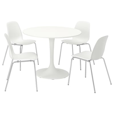 A DOCKSTA dining set with a white round table and four matching chairs, designed for small spaces with a modern, comfortable look.