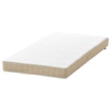 This image shows a white, rectangular baby mattress with beige trim, featuring a quilted design and handle.