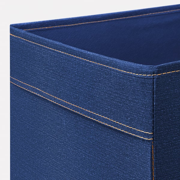 Blue denim-textured storage bin with yellow stitching; corner close-up shows quality fabric and sewing.