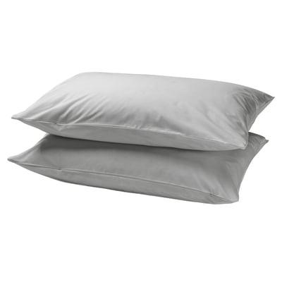 Two stacked, pure white, rectangular pillows with smooth, simple design. Made from 100% cotton, DVALA brand.