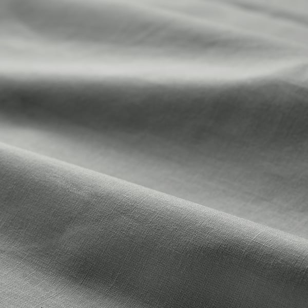 Soft, crumpled cotton fabric, close-up, smooth texture, natural fibres.