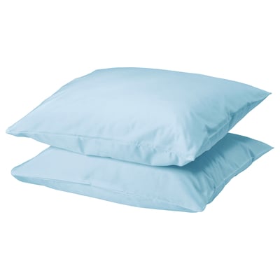 Two light blue DVALA pillows stacked, square-shaped, made of soft 100% cotton.