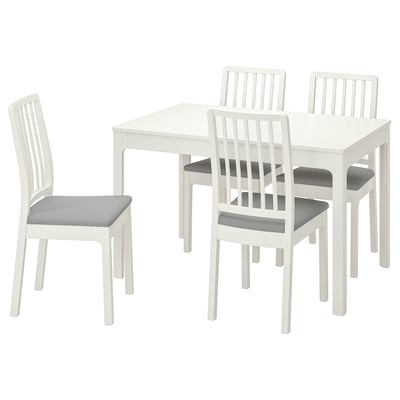 White wooden dining set with square table and 4 padded chairs.