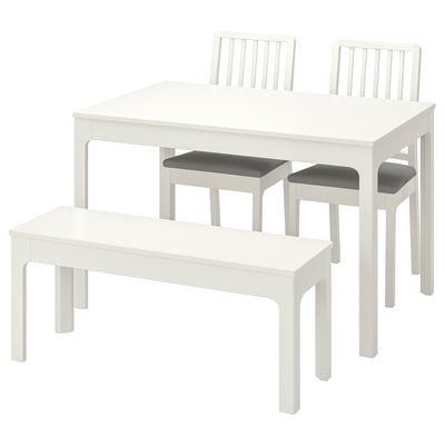 White EKEDALEN dining set, includes table, 2 benches, and 2 chairs.