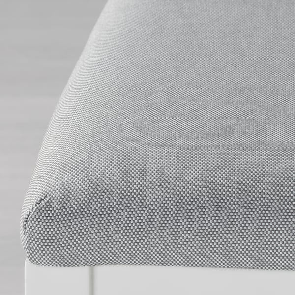 Close-up of a stylish, textured grey woven tablecloth, showcasing its intricate pattern and high-quality fabric.
