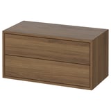An EKET storage cabinet, light brown, rectangular, with sleek design and two drawers.