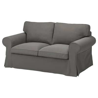 Gray EKTORP loveseat, smooth fabric, rolled arms, deep cushions.