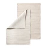 Handwoven beige cotton rug, unique design, rectangular shape, soft texture.