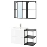 Modern bathroom set-up featuring white floating vanity, black metal shelves, and a black-framed mirror with sliding doors.