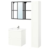 Modern bathroom setup: ENHET. White vanity, tall cabinet, black mirror frame.