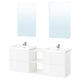 Modern white bathroom setup with two wall-mounted sinks, chrome fixtures, and rectangular mirrors. Sleek, glossy finish with open shelving.