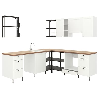 Modern white modular kitchen setup with wooden countertop, open shelves, and integrated sink.