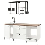 Ikea ENHET white kitchen unit with wooden top, black faucet, and hanging rack.