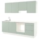 Modern kitchen unit in green with sleek drawers, sink, and cabinets.
