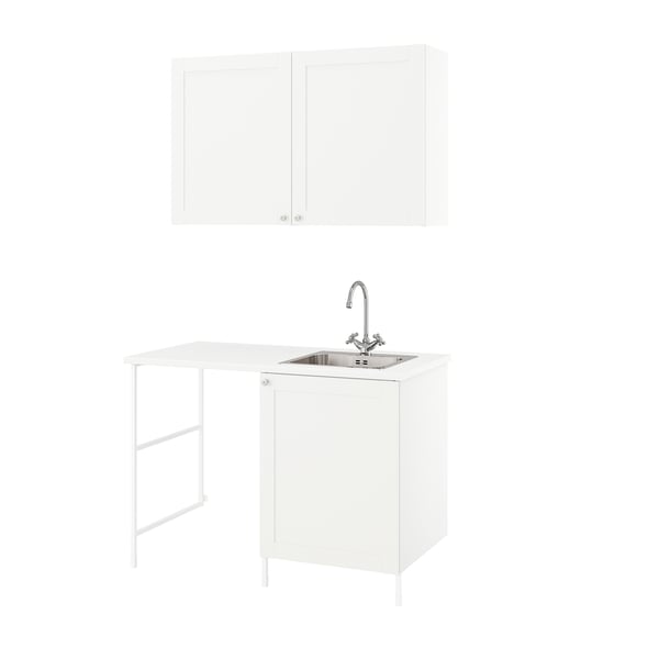 Modern white laundry unit: ENHET with sink and storage.