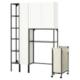 Modern ENHET storage system: white cabinet, black metal frames, shelves, and beige laundry bag on wheels.