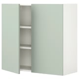 Light green ENHET wall cabinet with 2 shelves, modern & minimalist design, pale grey-green color.