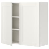 White ENHET wall cabinet with 2 shelves, framed doors, particle board & plastic foil, rectangular shape, simple design.