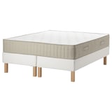 White ESPEVÄR/VATNESTRÖM bed set with beige detailing and wooden legs.