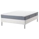 IKEA white & gray rolled mattress with metal legs.