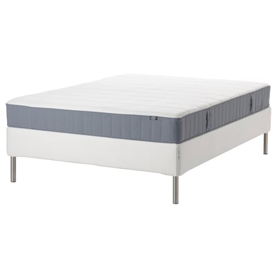 IKEA white & gray rolled mattress with metal legs.