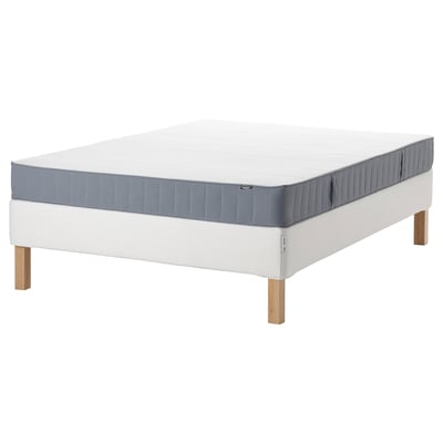 White bed base with grey mattress, wooden legs, firm bonnell spring support.