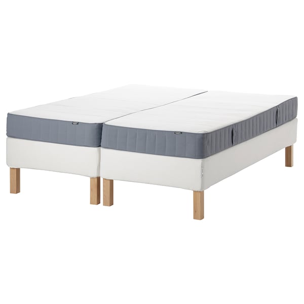 White/blue mattresses on wooden legs. Split design, great for separate sleep.