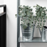 Metal shelf with two artificial plants in galvanized pots, one watering can. Perfect for both indoor and outdoor use.