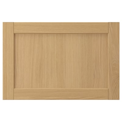This image shows a FORSBACKA wooden cabinet door in natural oak colour, featuring a rectangular shape with bevelled edges and a classic design.