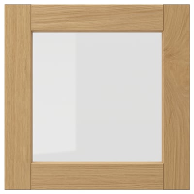 Square wooden frame in warm oak with clear glass centre, classic design.