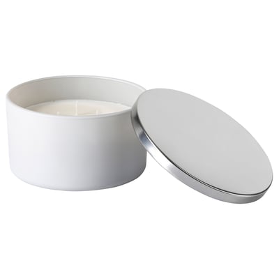White metal lidded candle jar with cotton wick. Modern, minimalist design.