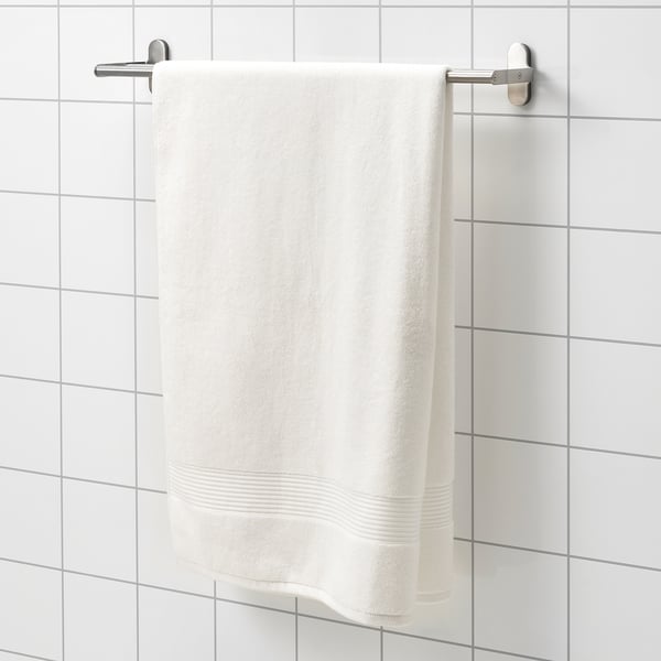 FREDRIKSJÖN white towel, thick & soft, hangs on wall rack. Pure cotton, large, with woven border detail.