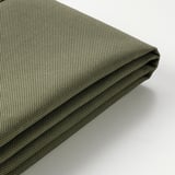 Close-up of durable, green, textured outdoor cushion with folded edge, showing quality fabric and stitching.