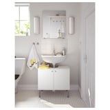 Bright white bathroom with FULLEN cabinet, sink, mirror & accessories. Clean, modern design with closed doors.