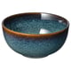 Ceramic bowl, ocean-blue and gold. Rounded shape with reactive glaze texture. Part of the GLADELIG series.