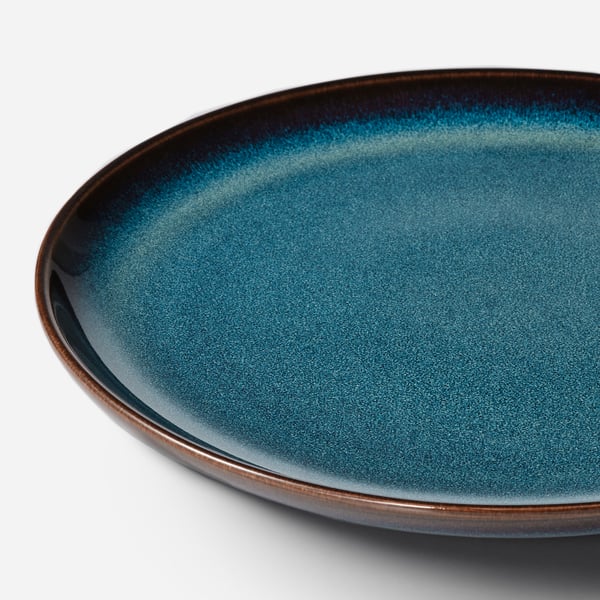 Blue plate with gold rim.