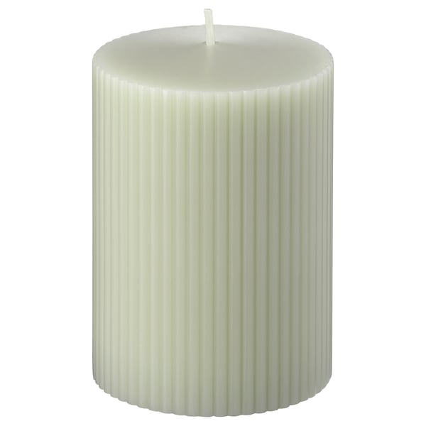 White GLASBJÖRK candle, ribbed design, standing upright.