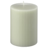 White GLASBJÖRK candle, ribbed design, standing upright.