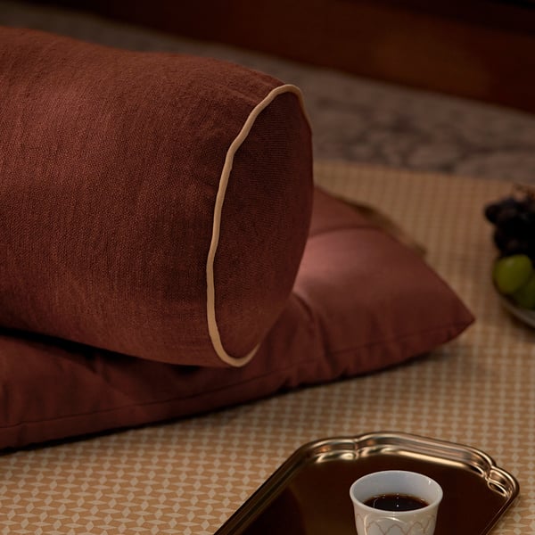 GOKVÄLLÅ Cushion, cylinder shaped/brown, 55 cm