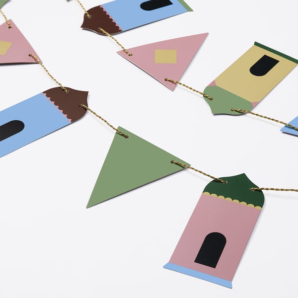 Colorful paper house garland, festive wall decor, hangs easily, high-quality design.