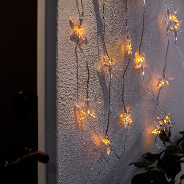GOKVÄLLÅ: star-shaped string lights on wall, warm glow, small, decorative, battery-operated.