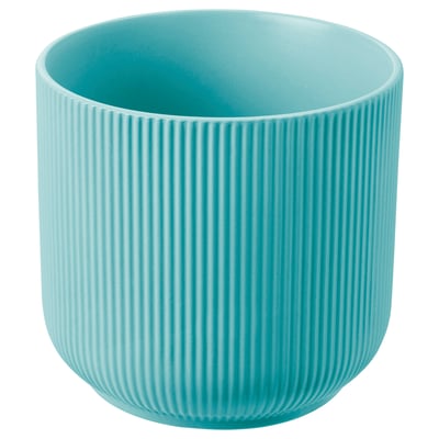 A round, plain blue ceramic planter with vertical groove designs. Its made of stoneware.