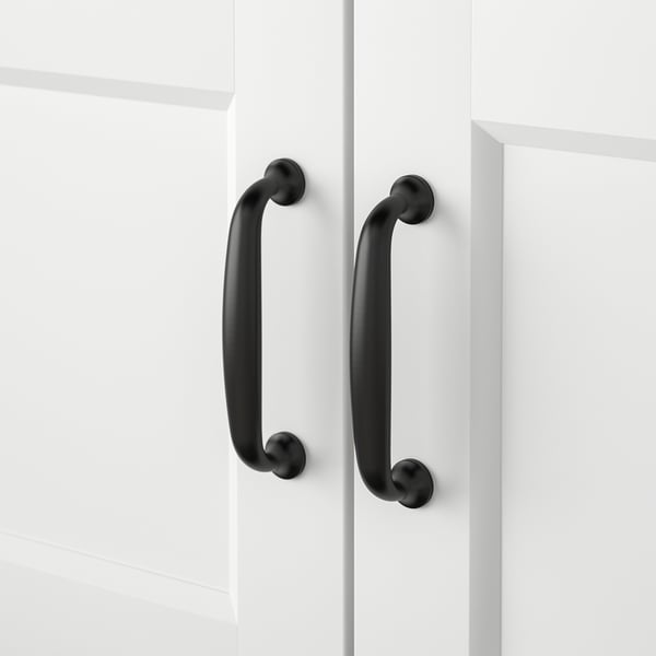 Two black handles on white cabinet doors. Smooth finish, sleek design, modern aesthetic.