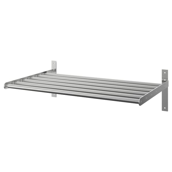 A GRUNDTAL stainless steel drying rack, wall-mounted, adjustable, with a sleek design for drying clothes or items.