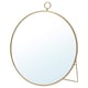 A round, brass-colored GRYTÅS mirror with a metal frame and stand. It can hang or stand, adding elegance to any space.