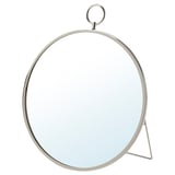 A round, nickel-plated mirror named GRYTÅS with a sleek, minimalist design. It can be hung on the wall or stood on a surface.