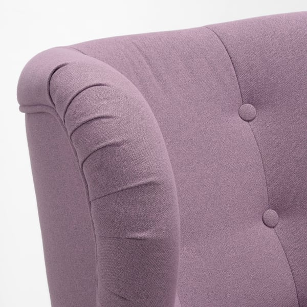 A high-quality armchair with rolled arms and buttoned back in purple fabric, showcasing detailed craftsmanship.