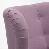 A high-quality armchair with rolled arms and buttoned back in purple fabric, showcasing detailed craftsmanship.
