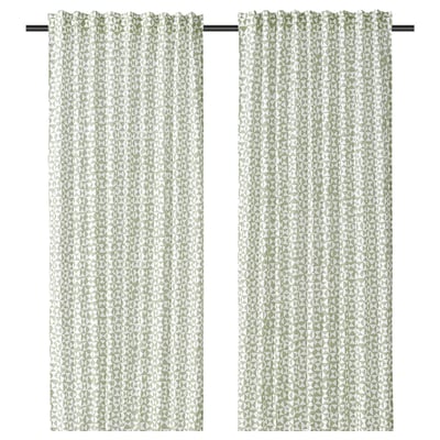 A pair of green and white triangle patterned curtains named HÅRKÖRVEL, made from recycled polyester.