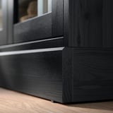Dark wooden furniture piece, likely part of HAVSTA series, showcasing detailed craftsmanship with clean lines and brushed finish.